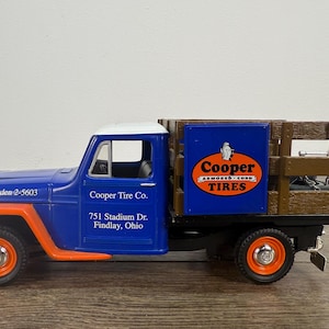 Liberty Classic Cooper Tires 1953 Willys Jeep Stake Bed Truck Collectible Die Cast Vehicle