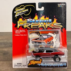Johnny Lightning Zingers 1968 Chevy Chevelle SS Red 1:64 Die-Cast Street Freaks Muscle Car Collectible