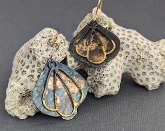 Stalen en gouden coquilleoorbellen