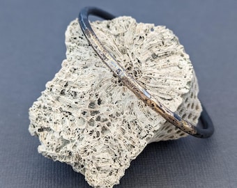 Gesmolten gouden en stalen manchet