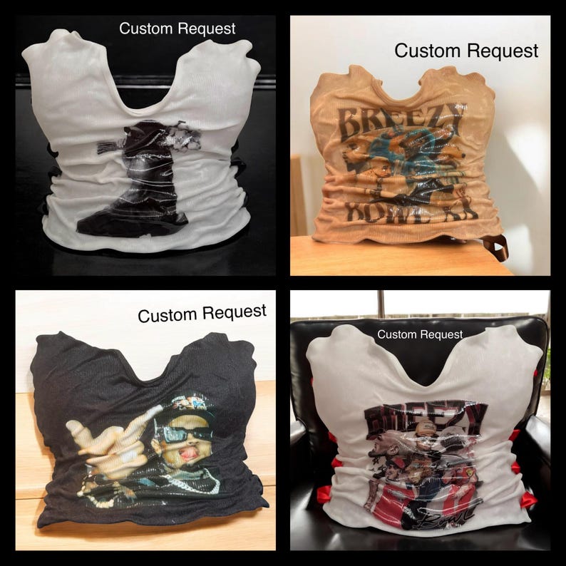 May include: Four t-shirts, each with a unique graphic design, are displayed. One is white with a black boot image, another is tan with "Breezy Power" text, a third is black with a person wearing sunglasses, and the last is white with a graphic and "Breezy" text.