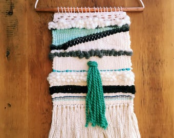 Ivory, gray, teal and copper woven wall hanging