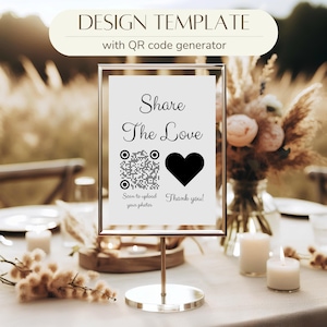 Może przedstawiać: Biały znak z czarną ramką na srebrnym stojaku. Znak zawiera napis "Share The Love" oraz kod QR i czarne serce. Tekst pod kodem QR brzmi "Scan to upload your photos" i "Thank you!"