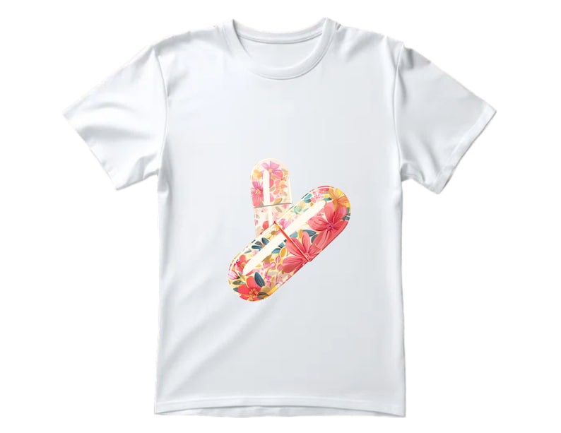 May include: White t-shirt featuring a floral print of two pills.