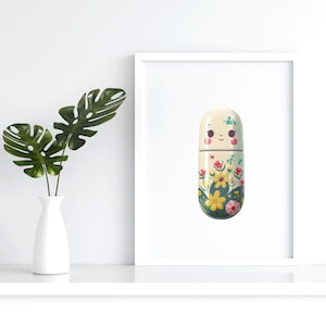 May include: A white pill-shaped object with a smiling face and floral pattern. The object is in a white frame against a white background.