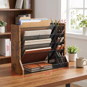 May include: A wooden desk organiser with multiple compartments for files, notebooks, and pens. The organiser is 41.9 cm wide, 32 cm tall, and 10.4 cm deep. It has a rustic, distressed finish and a black mesh design.