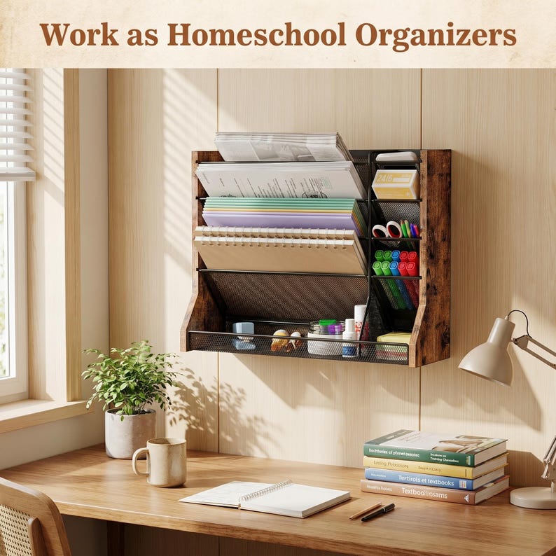 May include: A wooden wall-mounted organiser with multiple compartments, holding papers, notebooks, and stationery. The organiser is brown with a black mesh front. The text "Work as Homeschool Organizers" is at the top. A desk with a plant, mug, and books is in the foreground.
