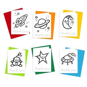 May include: Six printable thank you cards with a space theme. Each card features a different black and white illustration of a rocket, planet, moon, alien, star, and spaceship. The cards have a colorful background and the text "thank you" is written on each card.