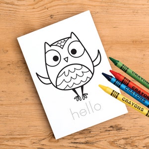 May include: A black and white line drawing of an owl with the word "hello" written in dotted lines below it. Four crayons are on the right side of the image: green, red, blue, and yellow.