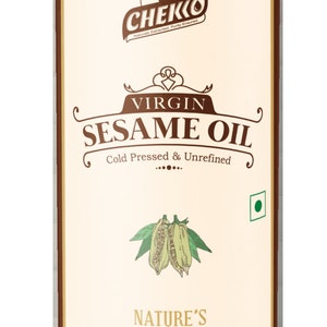 May include: A brown can with a label that says "Chekko Virgin Sesame Oil Cold Pressed & Unrefined Nature's Extract 1 ltr (Net Weight 900 g) at 32&deg;C".