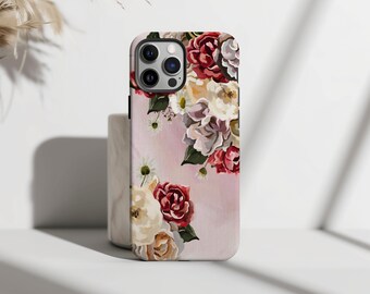 May include: A pink floral phone case with a bouquet of red, white, and pink flowers. The case has a cutout for the camera lens.