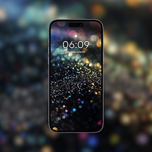 May include: A locked smartphone screen displaying the time 06:09 with the date Sunday, June 09. The background is a dark, glittery image with colorful sparkles.