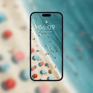 May include: A smartphone displaying a beach scene with people, umbrellas, and the time 06:09. The date is Sunday, June 09.