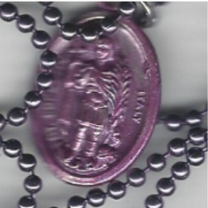May include: A purple metal pendant with a religious figure and a chain.