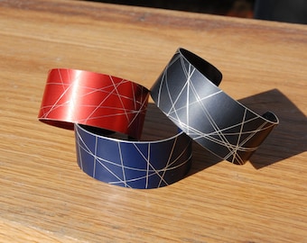 Anodized aluminum bracelets - hand scored and cut