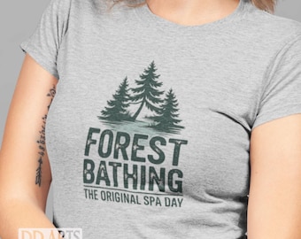 May include: A gray t-shirt with a green forest scene and the text "Forest Bathing The Original Spa Day".