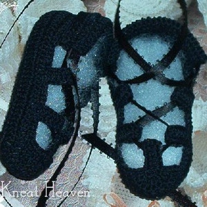 May include: A pair of black crocheted baby shoes with white accents. The shoes have a lace-up design and are made with a soft, textured yarn.
