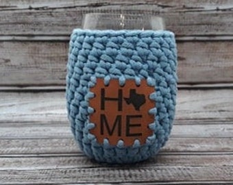 Crochet Stemless Wine Glass Cozy in blue with a Texas Home Vegan Leather Patch
