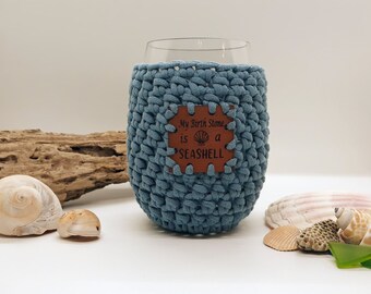 Crochet Stemless Wine Glass Cozy in blue with a My Birth Stone is a Seashell Vegan Leather Patch