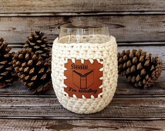Crochet Stemless Wine Glass Cozy in cream with Shhhhh I'm Reading Vegan Leather Patch