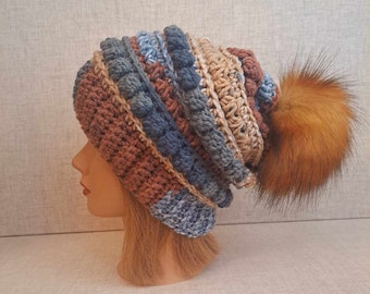 Ladies Crochet Beanie hat in blue, rust/brown and beige with a Detachable Pom Pom