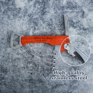 May include: A multi-functional wine opener featuring a reddish-brown wood handle engraved with the text Willow & Henry and the date 02.09.2024. The tool includes a stainless steel corkscrew, a bottle opener, and a small foil cutter blade.