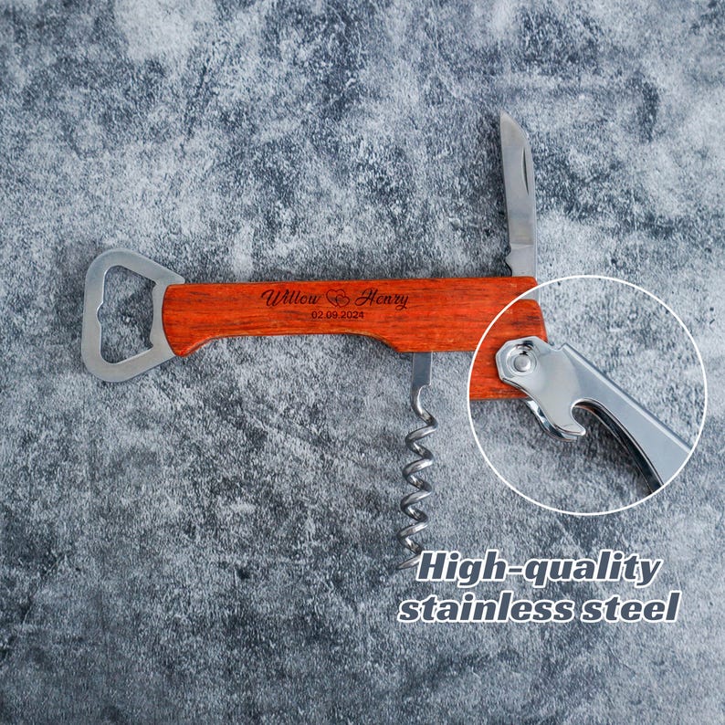 May include: A multi-functional wine opener featuring a reddish-brown wood handle engraved with the text Willow & Henry and the date 02.09.2024. The tool includes a stainless steel corkscrew, a bottle opener, and a small foil cutter blade.