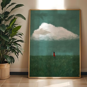 Peut inclure: Une impression d'art encadrée rectangulaire représentant un paysage vert foncé avec un grand nuage blanc dans le ciel et une petite silhouette vêtue d'une robe rouge debout au milieu d'un champ d'herbe, dans un cadre en bois clair.