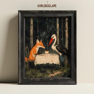 May include: A framed watercolor painting of a fox and a stork sitting at a table in a forest setting. The fox is orange and white, and the stork is white with a red beak. They are both looking at each other, and there is a cup and saucer on the table between them.