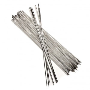 May include: A bundle of thin, silver-colored metal skewers. The skewers are arranged in a criss-cross pattern.