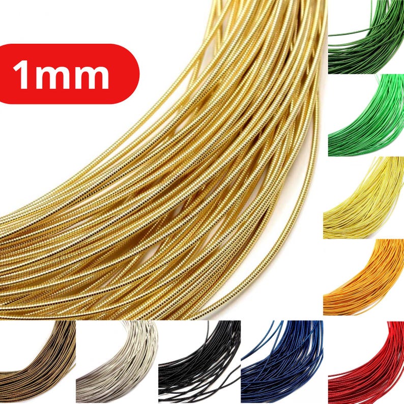 May include: A collection of 1mm diameter flexible craft wire coils in various colors including gold, dark green, bright green, yellow, orange, brown, silver, black, blue, and red. Each coil features a smooth, coiled texture throughout.