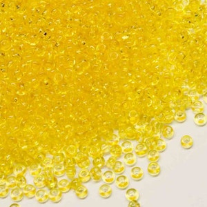 25g Preciosa 10/0 Vibrant Czech Glass Seed Beads Yellow colour lined Transparent (38886)