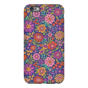 May include: A purple phone case with a retro floral pattern featuring orange, pink, yellow, and green flowers.