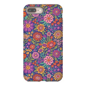 May include: A phone case with a retro floral pattern. The case features a variety of flowers in shades of pink, orange, yellow, and green on a dark blue background.