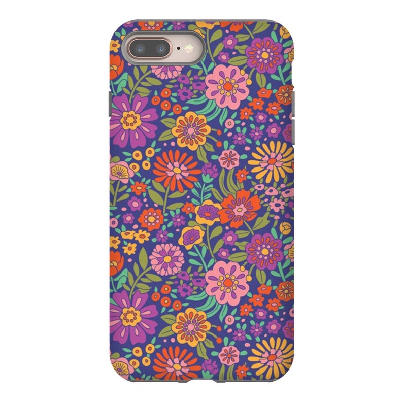 May include: A phone case with a retro floral pattern. The case features a variety of flowers in shades of pink, orange, yellow, and green on a dark blue background.