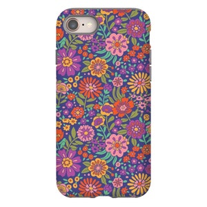 May include: A phone case with a retro floral pattern. The case features a variety of colorful flowers on a dark blue background.