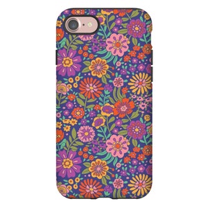 May include: A phone case with a retro floral pattern. The case features a variety of colorful flowers on a dark blue background.
