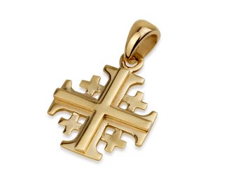 May include: A gold-colored pendant featuring a Jerusalem cross design. The pendant has a loop at the top for a chain and is set against a white background. The cross has a central cross with four smaller crosses in each quadrant.