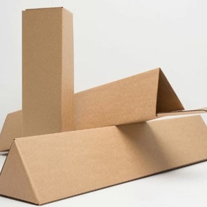 May include: Three brown cardboard boxes, one tall and rectangular, and two long and triangular.
