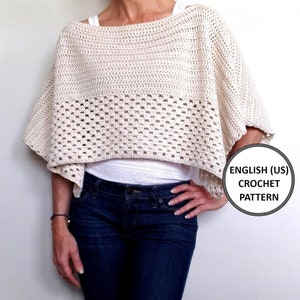 May include: A crocheted cream-colored poncho with a textured design. The poncho has a wide neckline and a shorter length.  "ENGLISH (US) CROCHET PATTERN" is written in black text on a white circle.