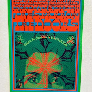 May include: A vintage concert poster for The Doors, featuring a psychedelic design with a green and red color scheme. The poster includes the text "The Doors" and "Break On Through To The Other Side".