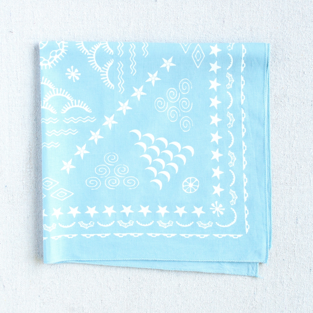 A light blue bandana with a four elements design, featuring earth, air, fire, and water elements