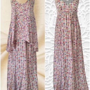 May include: Two long, flowing dresses. The dress on the left has a layered design with a top layer of colourful polka dots and a bottom layer of rectangular shapes. The dress on the right features a pattern of colourful rectangles.