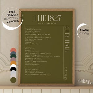 May include: A green poster with the text "THE 1827 THE HISTORY TOUR" and a list of song titles. The poster is framed in wood and has a white background. The text "CITY HALL 05.09.23" is on the right side of the poster.