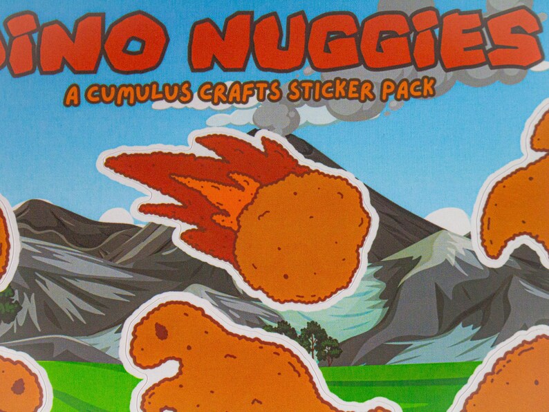 May include: A sticker pack featuring cartoon dinosaur-shaped chicken nuggets. The pack is called "Dino Nuggiges" and is a "Cumulus Crafts Sticker Pack". The stickers are on a white background with a cartoon volcano and mountains.