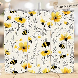 Puede incluir: Un juego de tres vasos de acero inoxidable con un diseño floral y de abejas. Los vasos presentan flores amarillas, abejas negras y hojas verdes sobre un fondo crema. El texto "Original Design" y "6 Free Designs Included!" son visibles.
