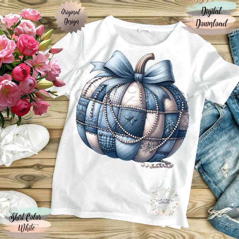 May include: White t-shirt with a blue and white patchwork pumpkin design, a blue bow, and pearl accents. The shirt has the words "Original Design" and "Digital Download" printed on it.