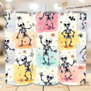 May include: Three stainless steel tumblers with a whimsical Halloween design. Each tumbler features a repeating pattern of dancing skeletons, spiders, hearts, and flowers on a colorful patchwork background. The text "6 Free Designs Included!" is visible.