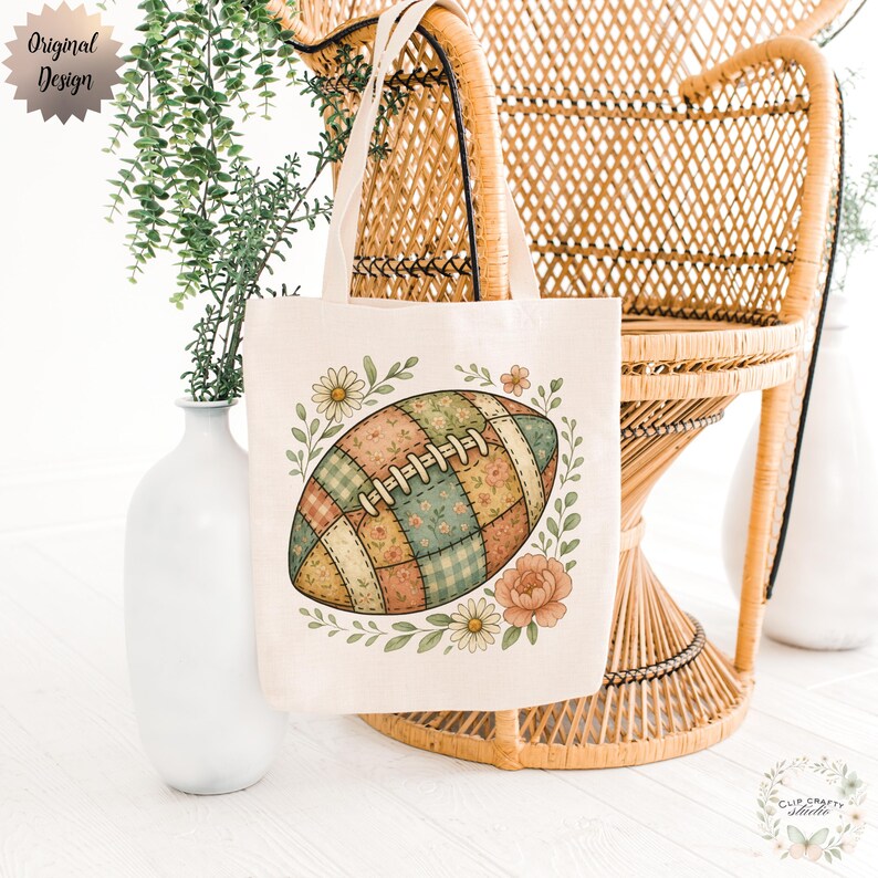 May include: A cream-colored tote bag featuring a football design with a patchwork pattern of floral and plaid fabrics. The football is surrounded by a wreath of flowers and leaves. The words "Original Design" are in the upper left corner.