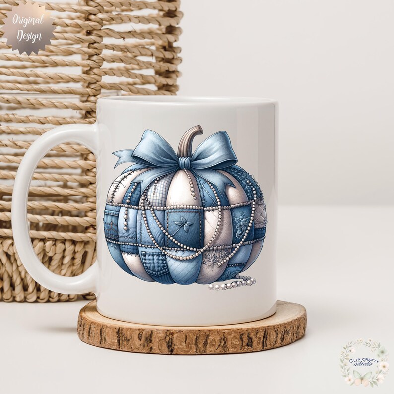 May include: White ceramic mug with a blue and white patchwork pumpkin design, a bow, and pearl accents. The mug sits on a wooden coaster. The words "Original Design" are printed on the top left of the mug.